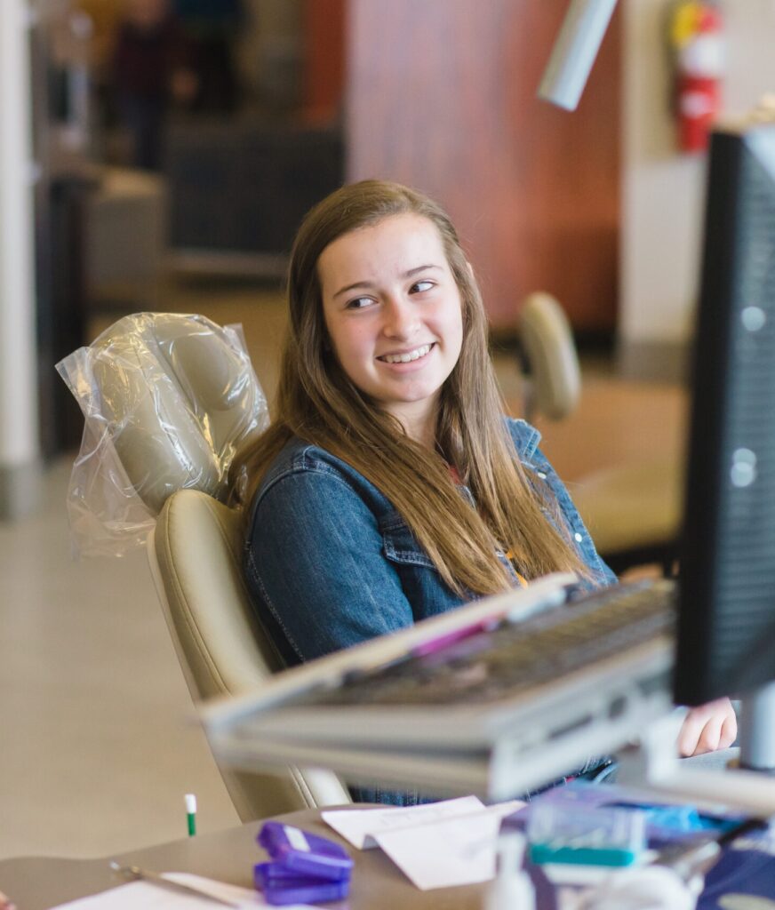 Bountiful orthodontics team member speaking with a teen patient at the Bountiful orthodontics office