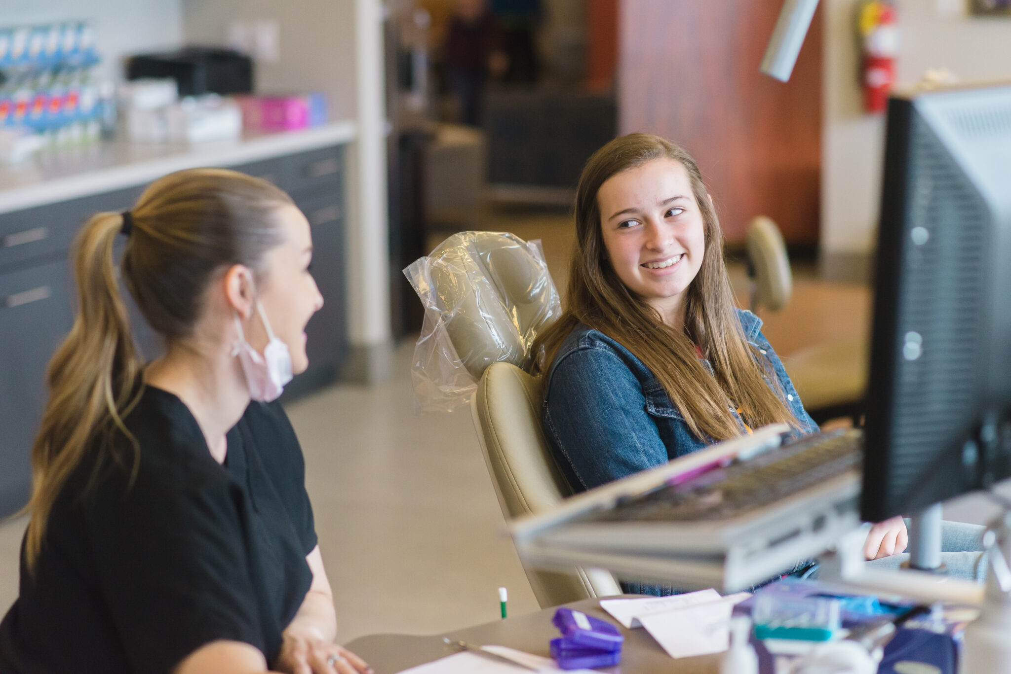 Bountiful orthodontics team member speaking with a teen patient at the Bountiful orthodontics office
